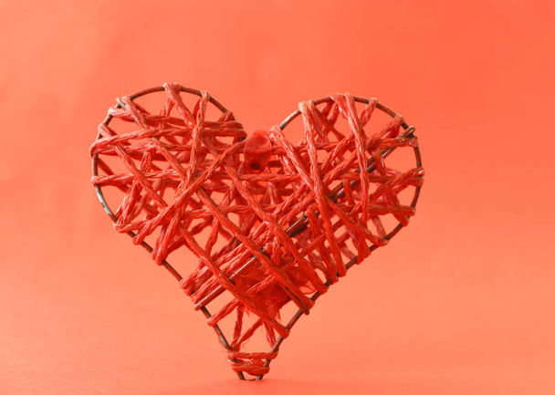 Handmade heart shape on red background - Photo, Image