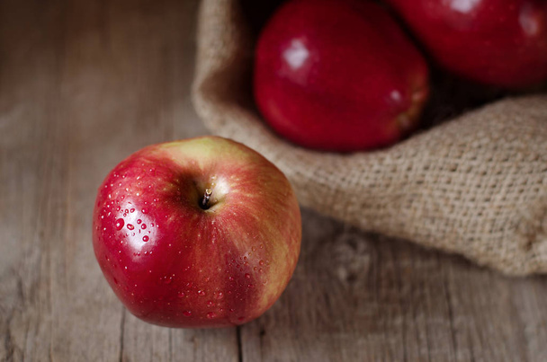 Ripe red apples on wooden background. Rustic style. - Foto, Imagem