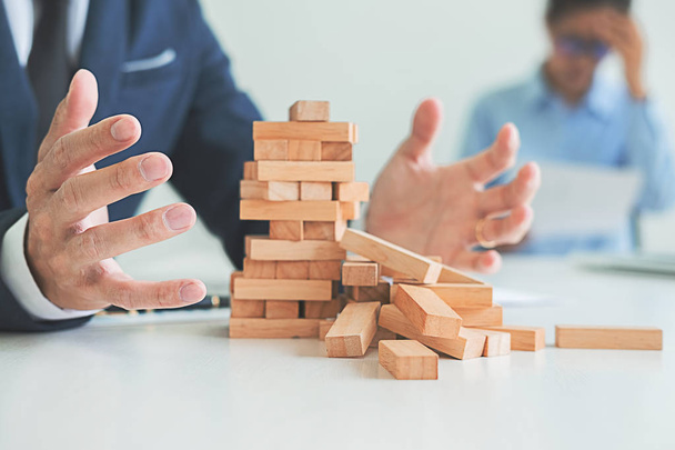 Problem Solving Business can't stop effect of dominoes continuous toppled with business team feeling sad and stress in office background. Failure Business Concept. - Foto, Imagem