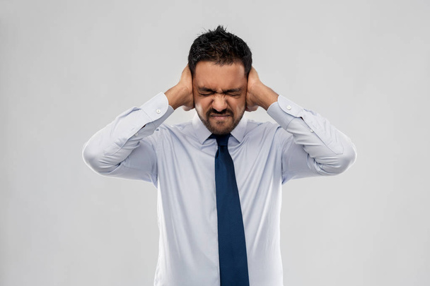indian businessman covering ears with hands - Photo, image
