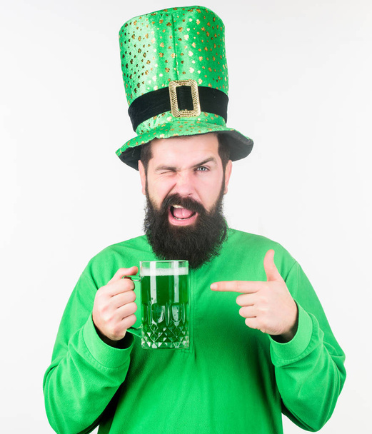 Irish tradition. Man brutal bearded hipster drink pint beer. Irish pub. Green beer mug. Drinking beer part celebration. Bar seasonal holiday menu. Alcohol consumption integral part saint patricks day - Photo, Image