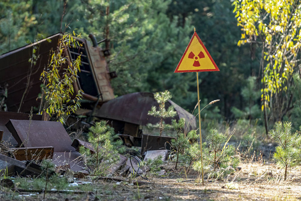 sign of radiation hazard on the background of radioactive garbage - Photo, Image