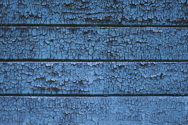 Textura fondo de madera con tablones cubiertos con pintura pelada vieja de color azul
.  - Foto, imagen