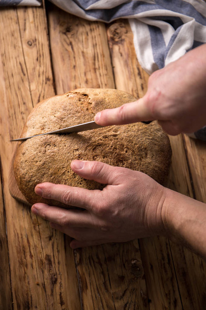 yeast free homemade bread on a wooden table - 写真・画像