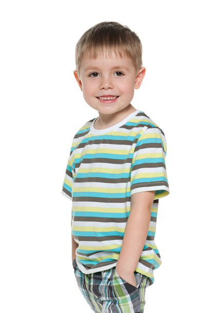 Little boy is standing on the white background - Photo, Image