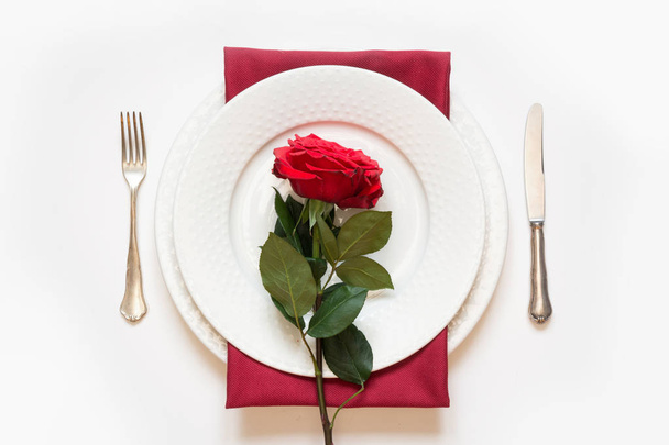Valentine's day dinner. Romantic table setting with red rose. Top view. - Photo, image
