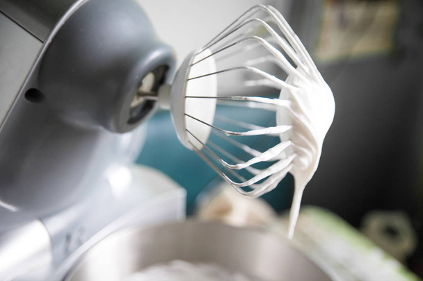 Whisk with creamy egg white or whipped cream - Fotó, kép