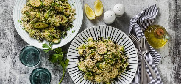 banner of salad with rice with zucchini, avocado, olives and capers. healthy spring summer vegan cuisine recipe for the whole family or party - Fotografie, Obrázek