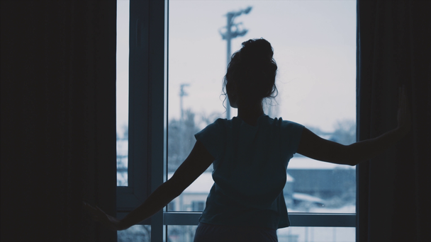 Young models in a modern high-rise house with full length windows, stretched out arms, welcoming the new day, dancing barefoot in the morning, bought a new apartment. A sense of a happy, alive, dream - Séquence, vidéo