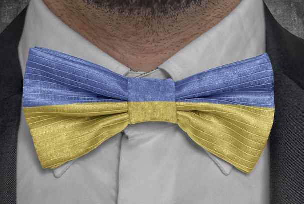 National flag of Ukraine on bowtie business man suit - Foto, imagen