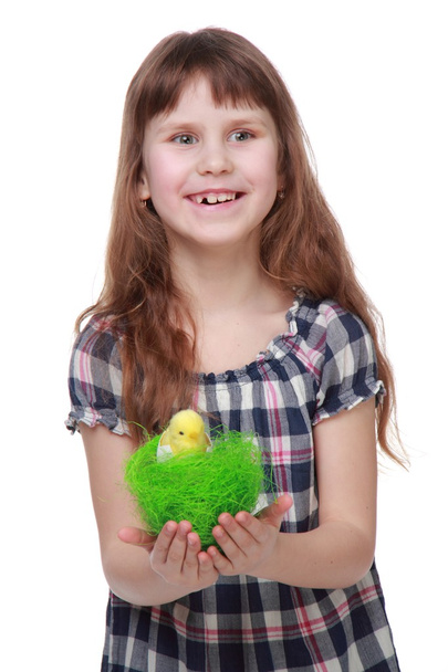 Charming little girl in a plaid dress preparing for Easter - Foto, Imagem