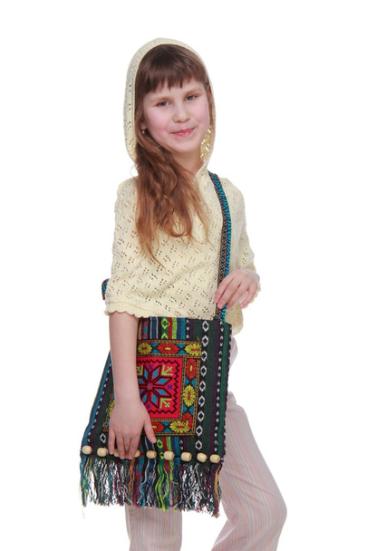 Cutel little girl with a bag of handmade on white background - Valokuva, kuva