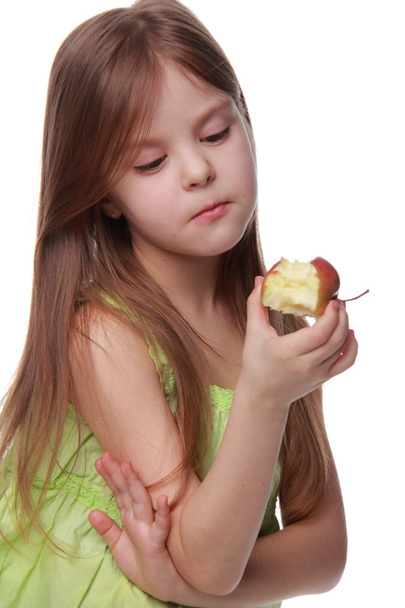 Caucasian cheerful girl eating an apple - Photo, Image