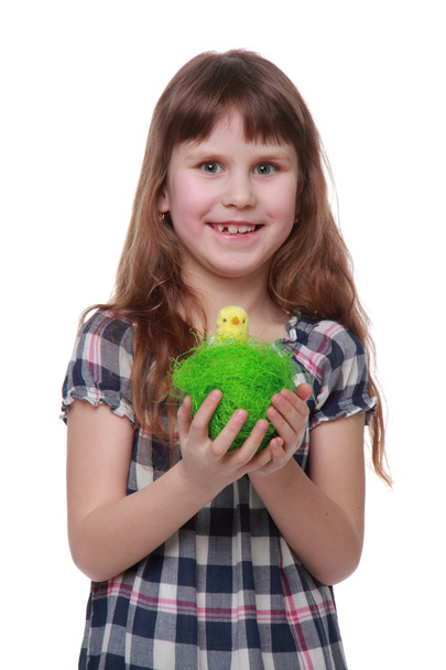 Pretty little girl holding an Easter decoration - 写真・画像