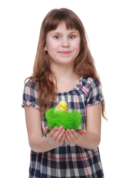 Pretty little girl holding an Easter decoration - 写真・画像