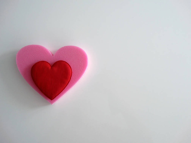 Isolated Red Heart in a Pink Heart on a White Background - Zdjęcie, obraz