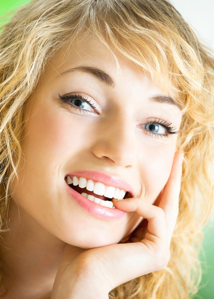 Smiling young beautiful woman, indoors - Photo, Image