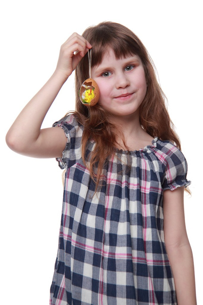 Lovely girl holding an Easter decoration - 写真・画像