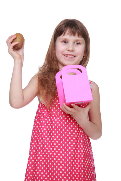 Healthy little girl in a summer dress holding a gift - Fotoğraf, Görsel