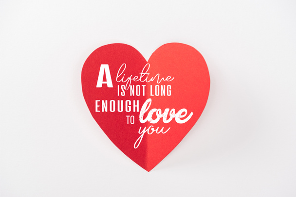 top view of heart made of paper isolated on white with "a lifetime is not long enough to love you" lettering, st valentines day concept - Zdjęcie, obraz