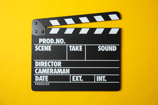 Clapperboard on color background, top view. Cinema production - Foto, Imagem