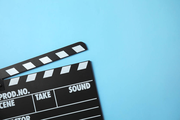 Clapperboard on color background, top view with space for text. Cinema production - Photo, Image