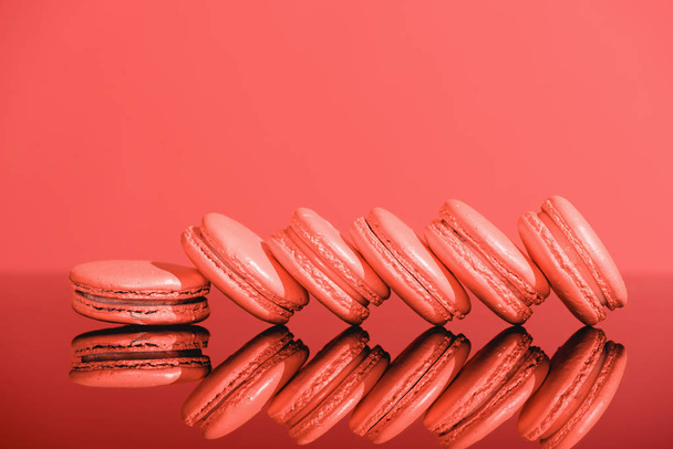 Living coral macaroons with reflection. Pantone color of the year 2019 concept - Valokuva, kuva