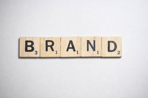 Scrabble wooden brown letter in Business Concept  on white background - Φωτογραφία, εικόνα
