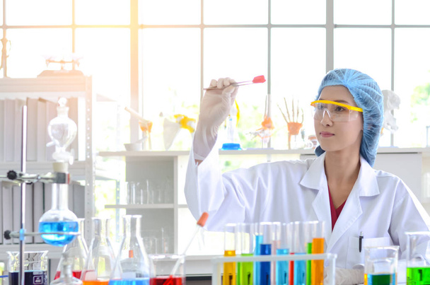 The woman scientist in laboratory doing experiments.Photo concept of Medical healthcare technology and pharmaceutical research and development. - Photo, Image