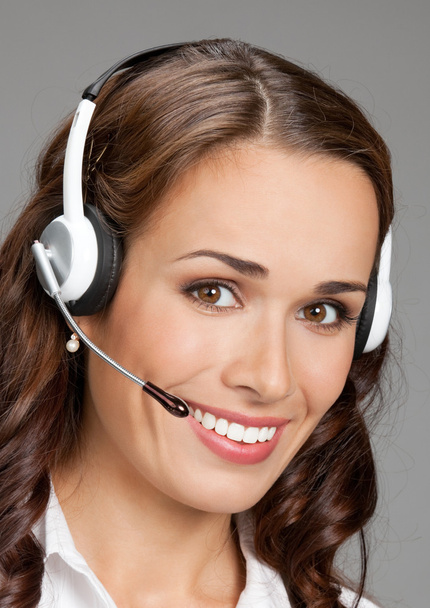 Support phone operator in headset, on gray - Φωτογραφία, εικόνα