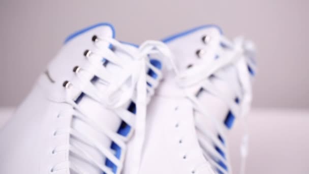 Close up view. New white figure skates on a white background. - Footage, Video
