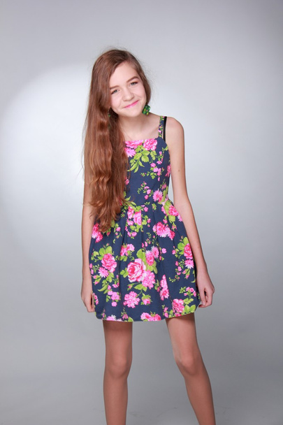 Studio portrait of a teenage girl in a dress - Foto, Imagen