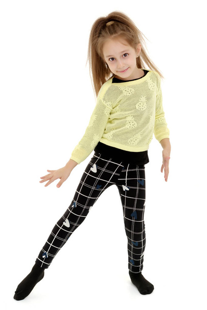 A cheerful little girl is dancing. - Photo, Image