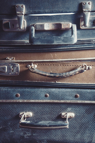 Vintage old suitcases  on top of each other - Фото, изображение