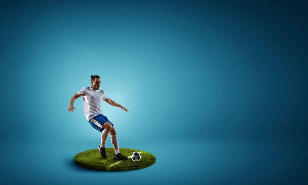 Soccer player on round pedestal. Mixed media - Valokuva, kuva