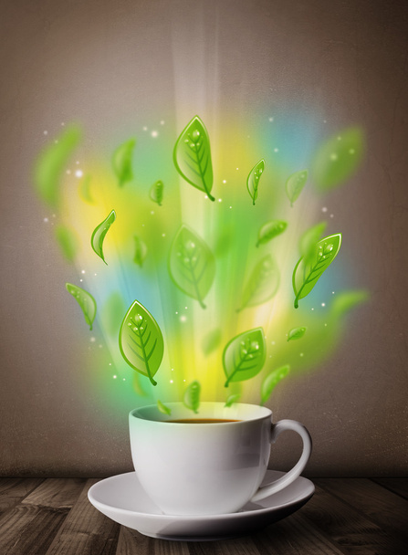 Tea cup with leaves and colorful abstract lights - Φωτογραφία, εικόνα