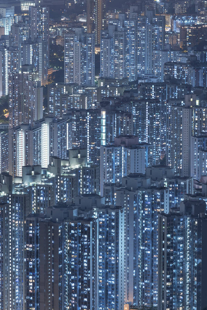 Highrise residential buildings in Hong Kong city at night - Photo, Image