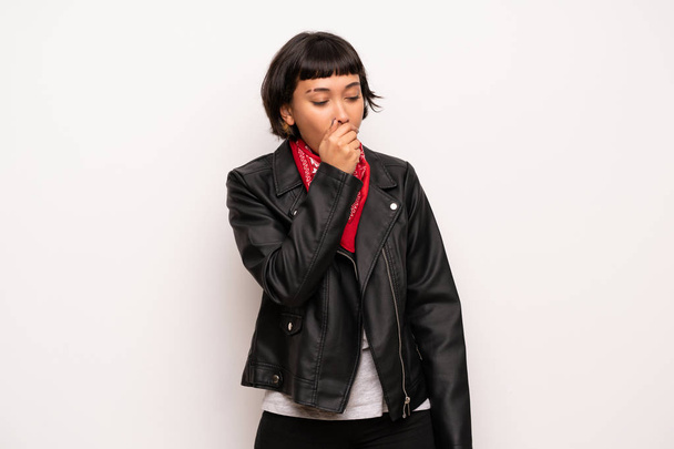 Woman with leather jacket and handkerchief is suffering with cough and feeling bad - Photo, Image