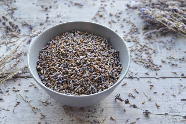 natural dry lavender flowers tea in ceramic bowl - Fotó, kép