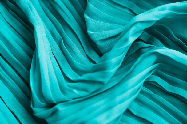 The texture of the mint pleated fabric. Blue georgette fabrics.  - Photo, Image