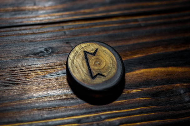 Rune Pertho (Peord) carved from wood on a wooden background - Elder Futhark - Фото, изображение