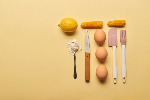 flat lay with kitchenware and ingredients on yellow background with copy space - Foto, imagen