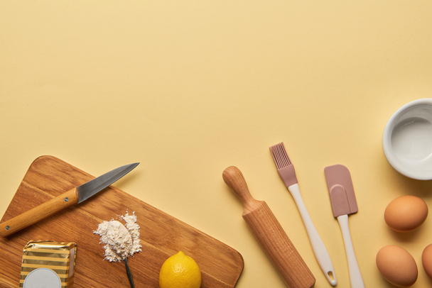 top view of cooking utensils and ingredients on yellow background with copy space - Zdjęcie, obraz