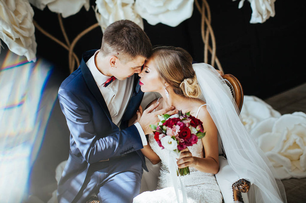 a couple in love - the bride and groom - gently kiss  on the wedding day - Zdjęcie, obraz