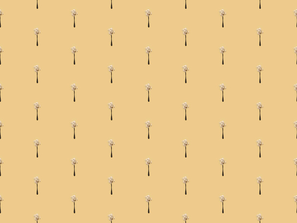 scattered flour in spoons on yellow background, seamless pattern - Photo, image