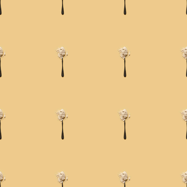 scattered flour in spoons on yellow background, seamless pattern - Foto, Bild