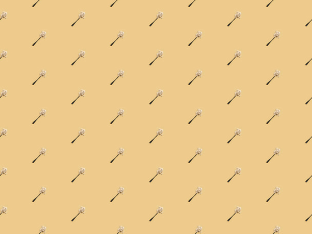 scattered flour in spoons on yellow background, seamless pattern - Fotografie, Obrázek