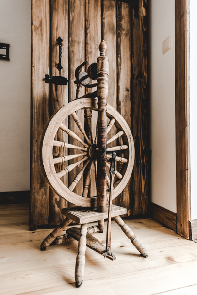 retro wooden loom near textured opened door in room - Photo, Image