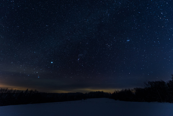 starry dark sky in carpathian mountains at night in winter - Photo, Image