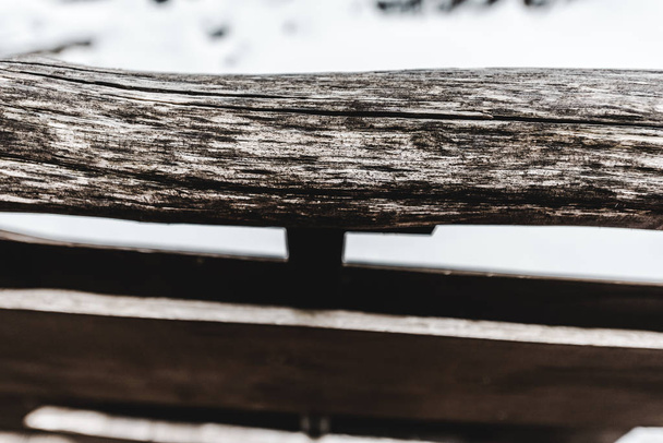 selective focus of aged weathered rustic wooden plank on snowy background - Foto, Imagem